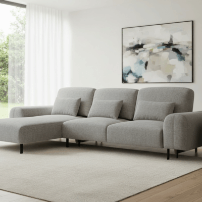 szary narożnik z funkcją spania w salonie