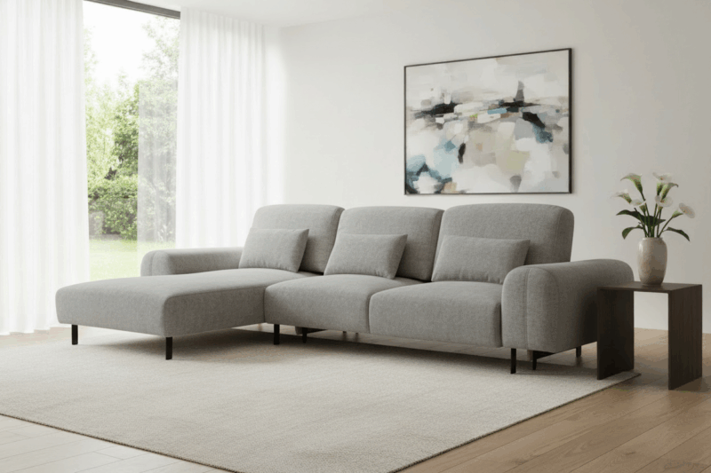 szary narożnik z funkcją spania w salonie